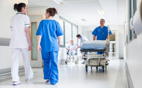 Hospital corridor with health care professionals